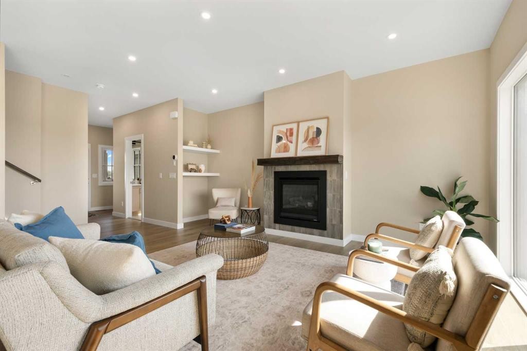 329 Flare Avenue Sw, Diamond Valley, AB - Indoor Photo Showing Living Room With Fireplace