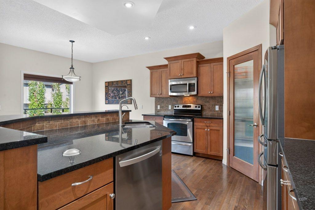 164 Aspenmere Close, Chestermere, AB - Indoor Photo Showing Kitchen With Stainless Steel Kitchen