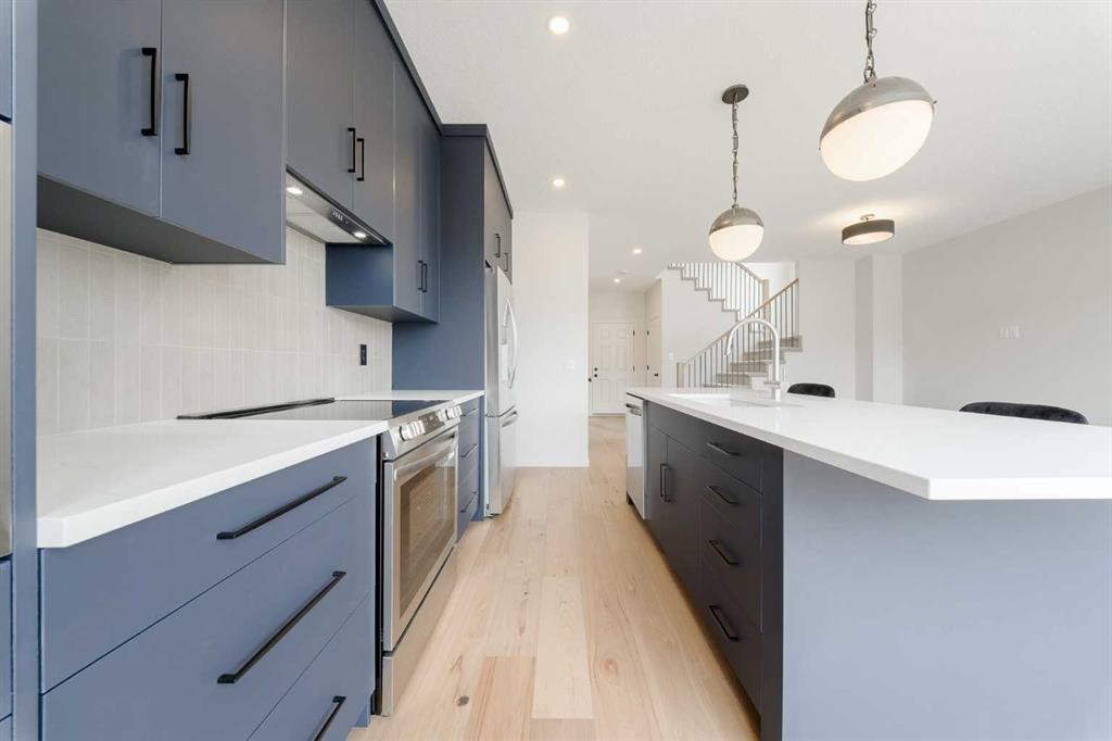 96 Fireside Common, Cochrane, AB - Indoor Photo Showing Kitchen With Upgraded Kitchen