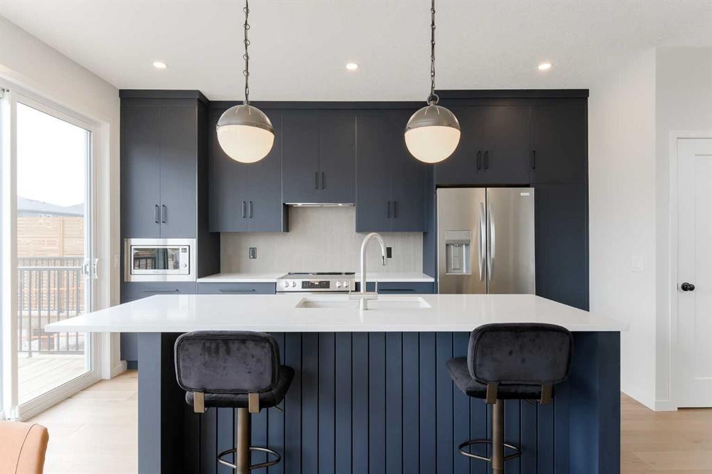 96 Fireside Common, Cochrane, AB - Indoor Photo Showing Kitchen With Upgraded Kitchen