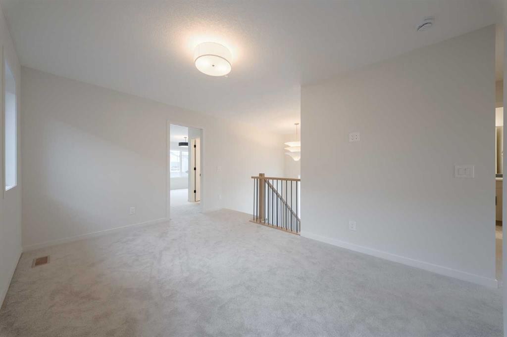 96 Fireside Common, Cochrane, AB - Indoor Photo Showing Other Room