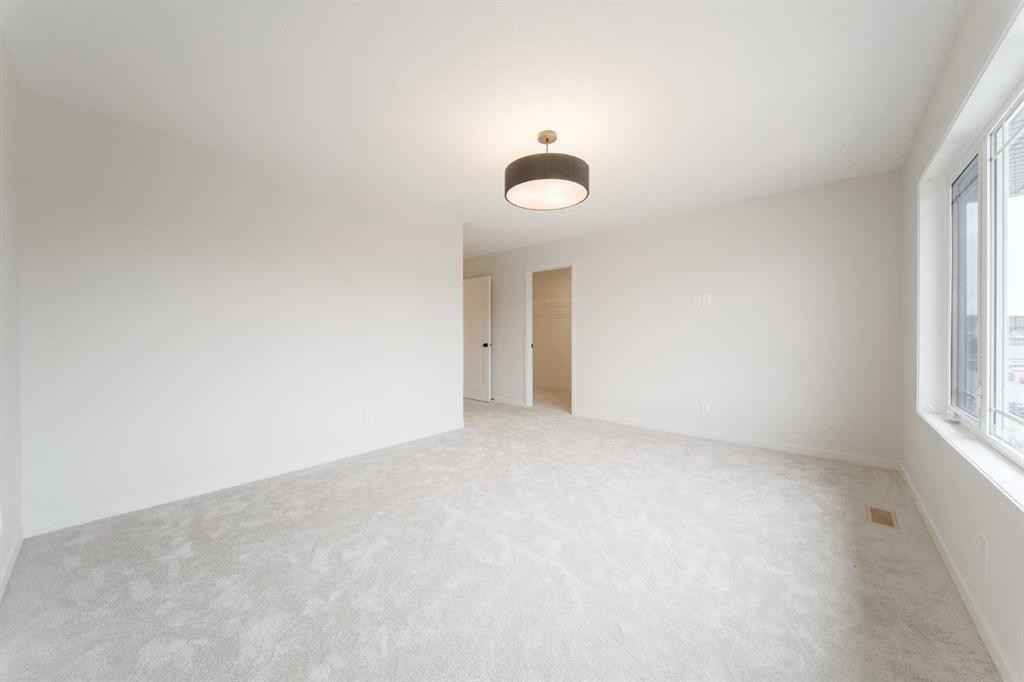 96 Fireside Common, Cochrane, AB - Indoor Photo Showing Other Room