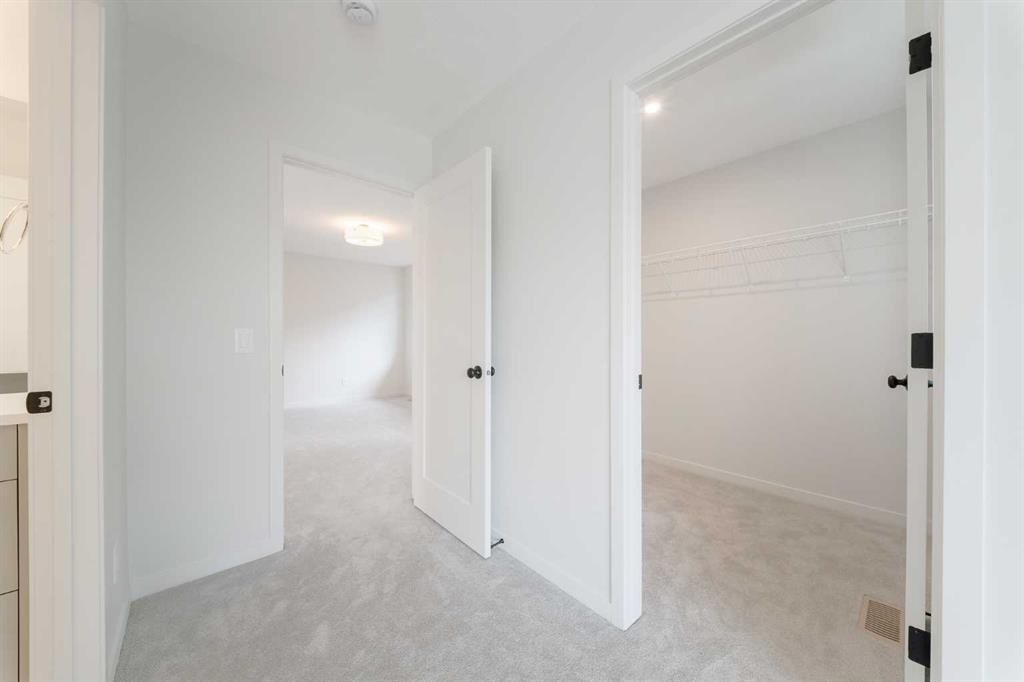 96 Fireside Common, Cochrane, AB - Indoor Photo Showing Other Room