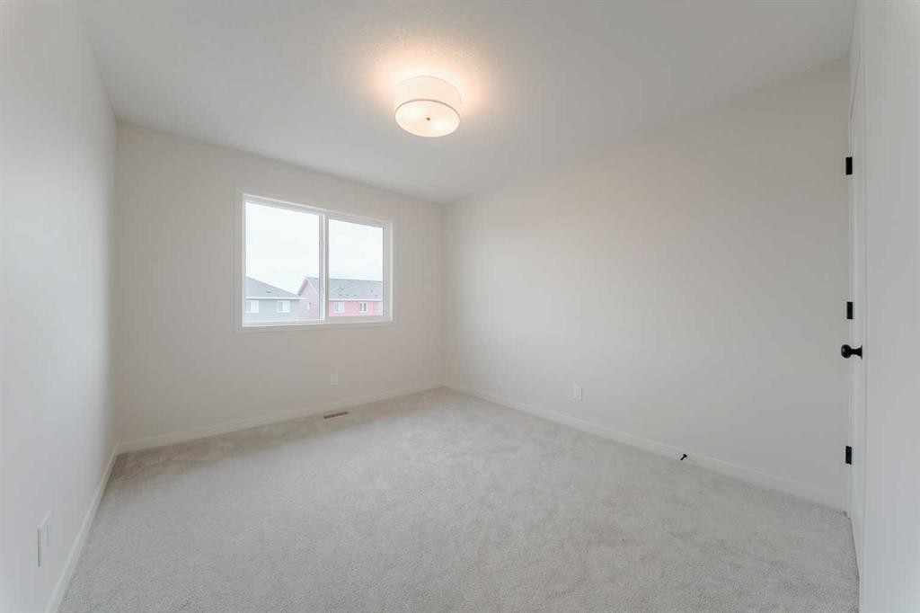96 Fireside Common, Cochrane, AB - Indoor Photo Showing Other Room