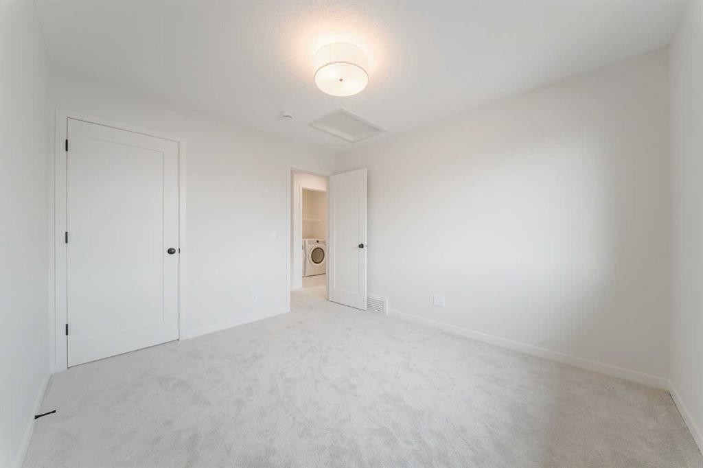 96 Fireside Common, Cochrane, AB - Indoor Photo Showing Other Room