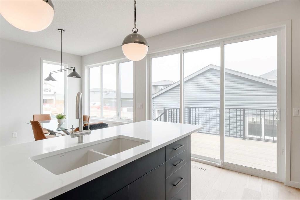 96 Fireside Common, Cochrane, AB - Indoor Photo Showing Kitchen With Double Sink