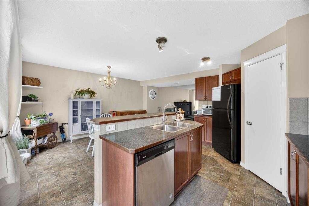 437 Tuscany Drive Nw, Calgary, AB - Indoor Photo Showing Kitchen With Double Sink