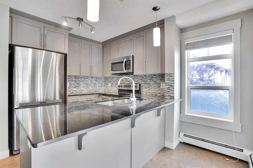 2201-155 Skyview Ranch Way Ne, Calgary, AB - Indoor Photo Showing Kitchen With Double Sink With Upgraded Kitchen