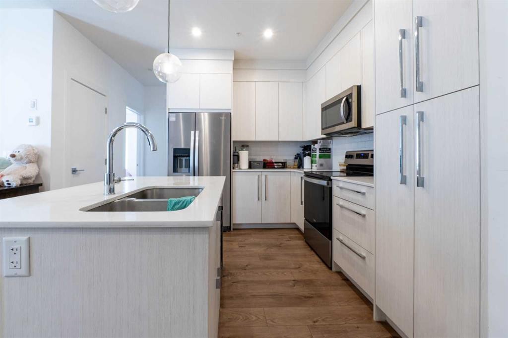 1207-681 Savanna Boulevard Ne, Calgary, AB - Indoor Photo Showing Kitchen With Double Sink With Upgraded Kitchen