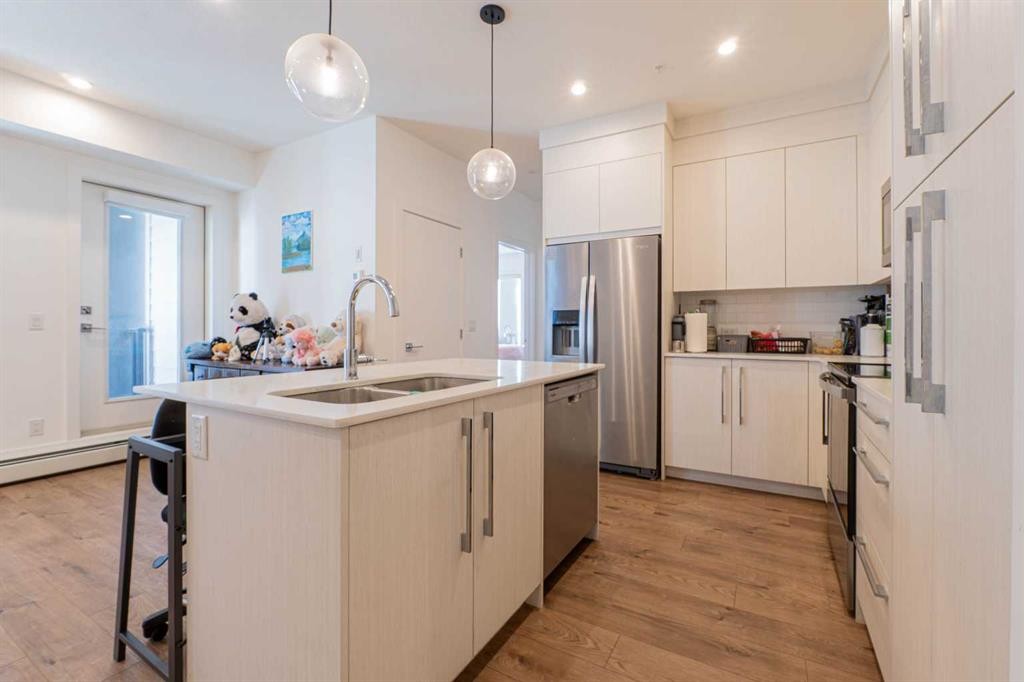 1207-681 Savanna Boulevard Ne, Calgary, AB - Indoor Photo Showing Kitchen With Double Sink With Upgraded Kitchen