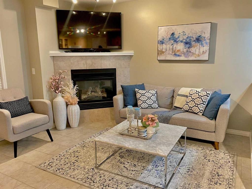 66 Chaparral Ridge Terrace Se, Calgary, AB - Indoor Photo Showing Living Room With Fireplace