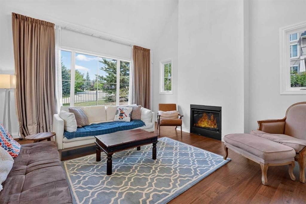 8 Spring Valley Lane Sw, Calgary, AB - Indoor Photo Showing Living Room With Fireplace