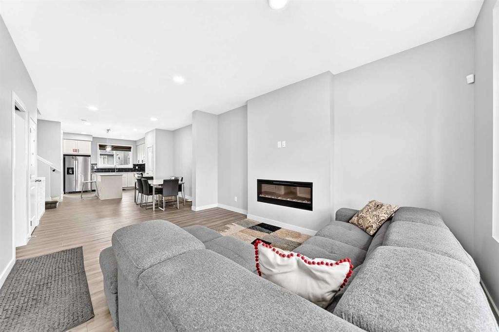 164 Langwell Common Se, Airdrie, AB - Indoor Photo Showing Living Room With Fireplace