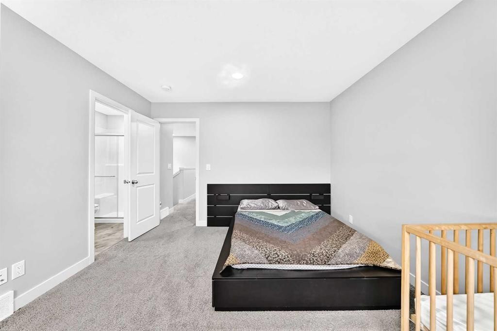 164 Langwell Common Se, Airdrie, AB - Indoor Photo Showing Bedroom
