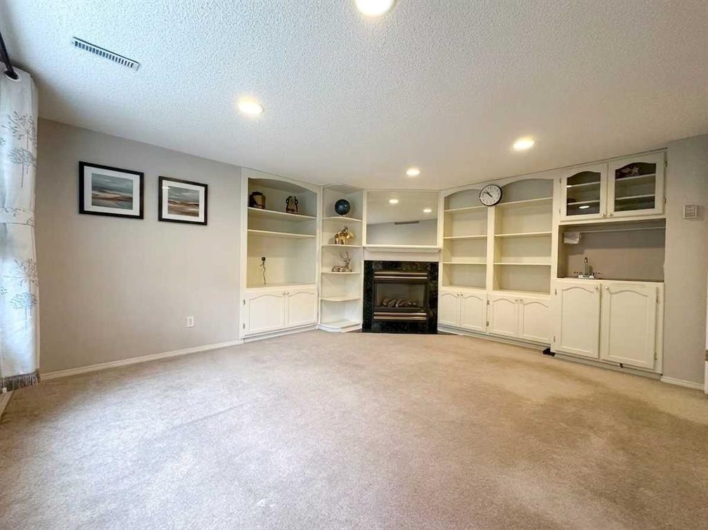 153 Hawkdale Circle Nw, Calgary, AB - Indoor With Fireplace