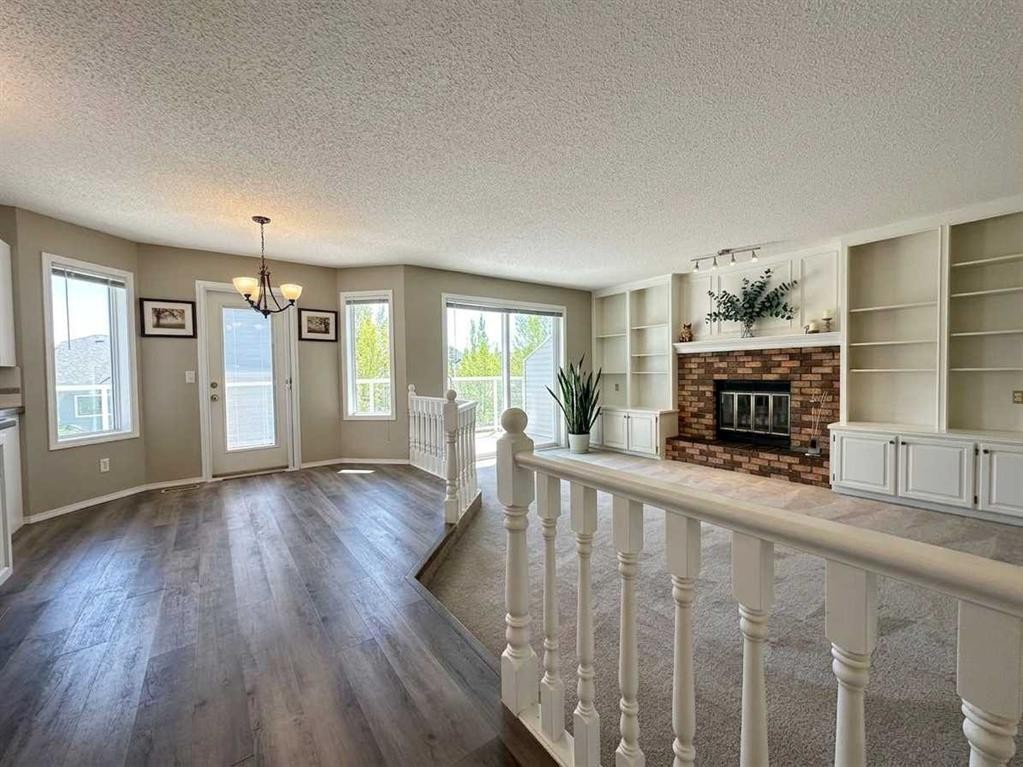 153 Hawkdale Circle Nw, Calgary, AB - Indoor With Fireplace