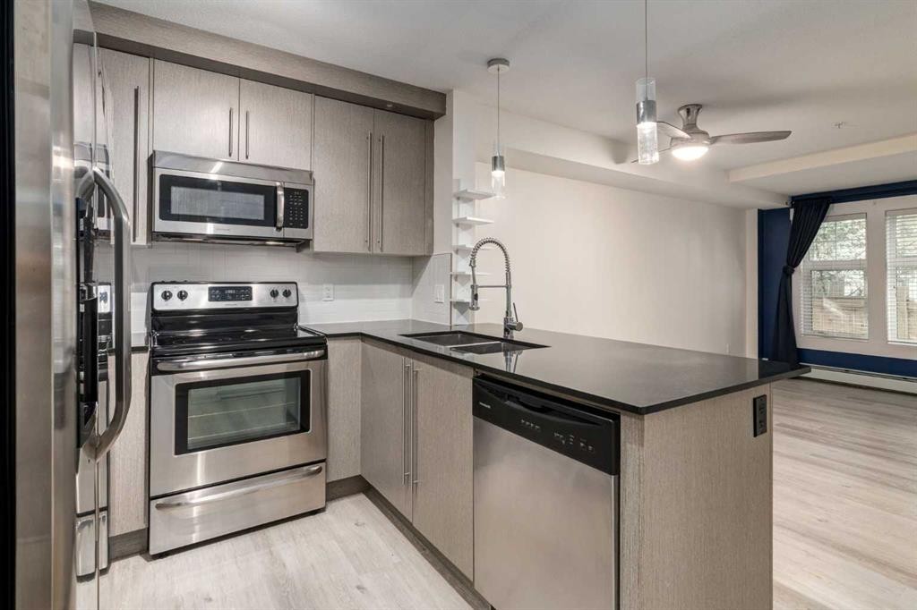 2108-11 Mahogany Row Se, Calgary, AB - Indoor Photo Showing Kitchen With Stainless Steel Kitchen With Double Sink