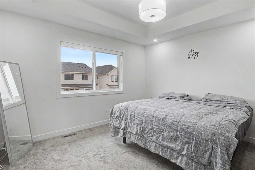 67 Copperhead Grove Se, Calgary, AB - Indoor Photo Showing Bedroom