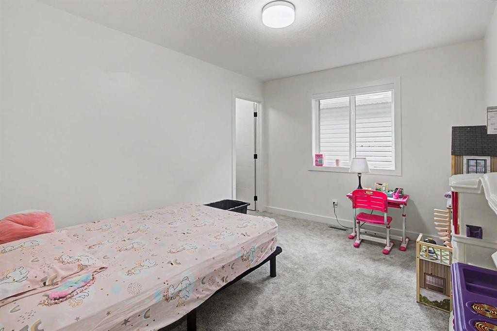 67 Copperhead Grove Se, Calgary, AB - Indoor Photo Showing Bedroom