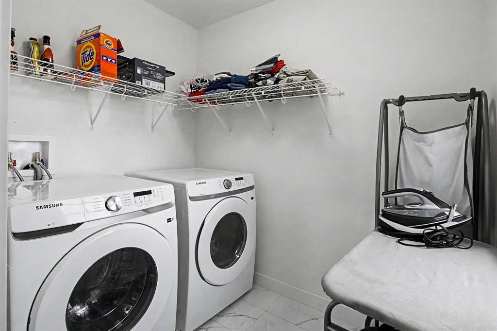 67 Copperhead Grove Se, Calgary, AB - Indoor Photo Showing Laundry Room