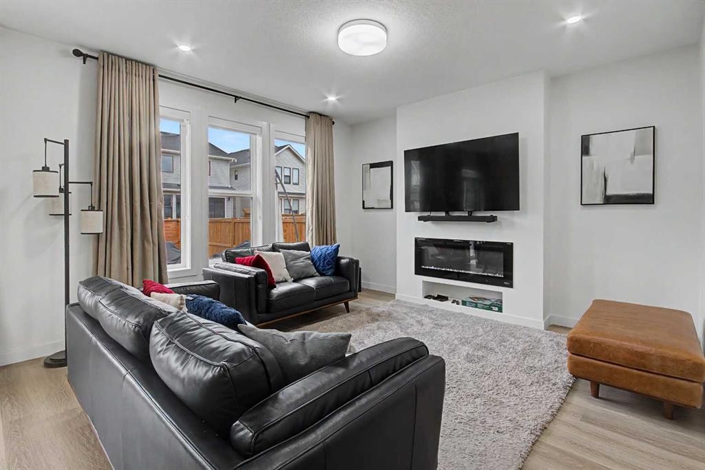 67 Copperhead Grove Se, Calgary, AB - Indoor Photo Showing Living Room With Fireplace