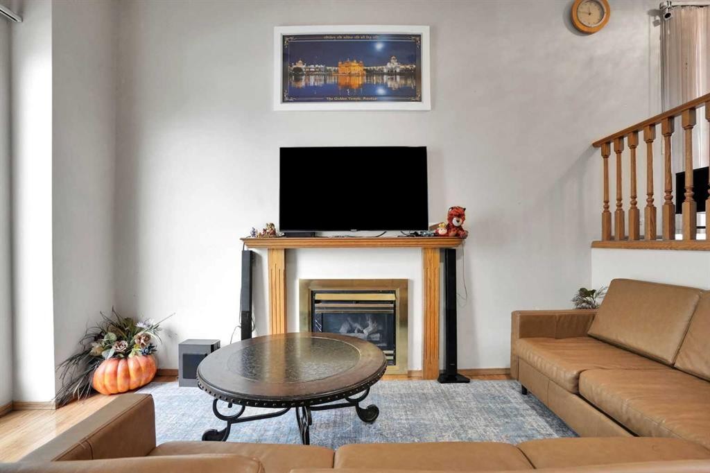 28 Martinridge Road Ne, Calgary, AB - Indoor Photo Showing Living Room With Fireplace