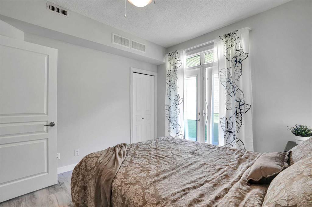 5-148 Rockyledge View Nw, Calgary, AB - Indoor Photo Showing Bedroom