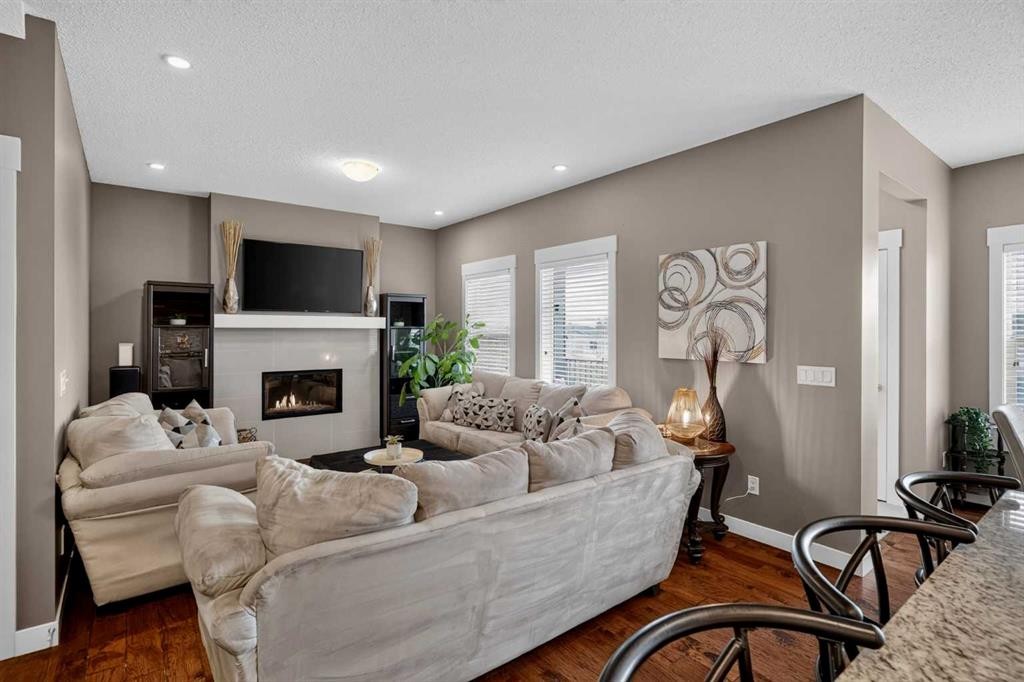 268 Rainbow Falls Green, Chestermere, AB - Indoor Photo Showing Living Room With Fireplace