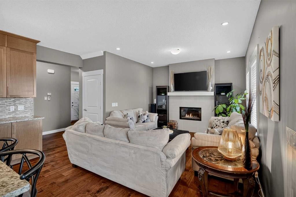 268 Rainbow Falls Green, Chestermere, AB - Indoor Photo Showing Living Room With Fireplace