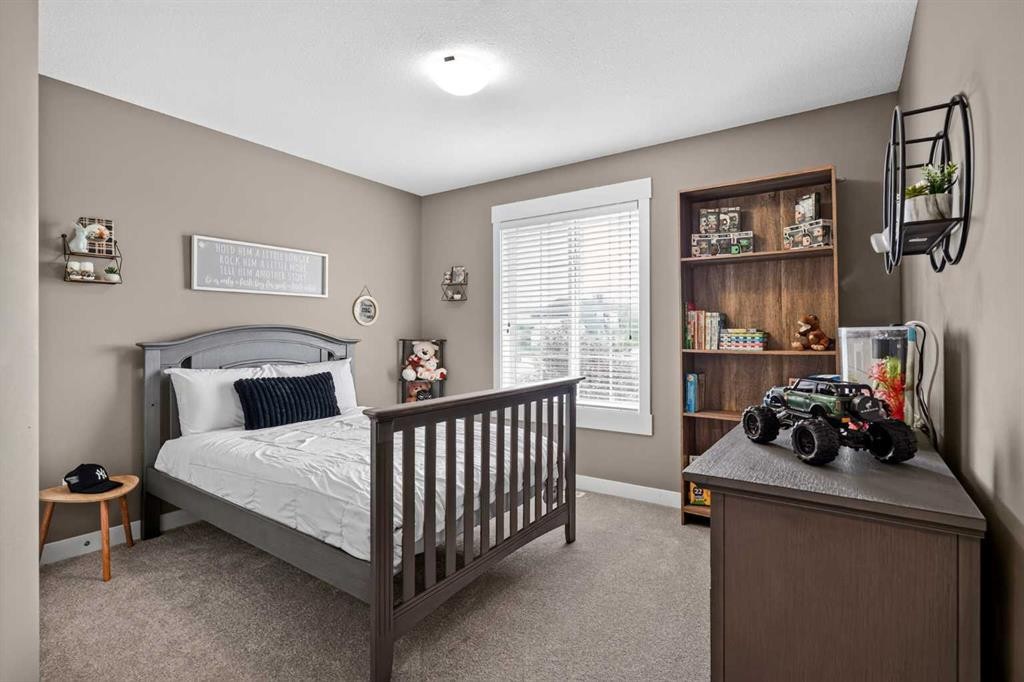 268 Rainbow Falls Green, Chestermere, AB - Indoor Photo Showing Bedroom