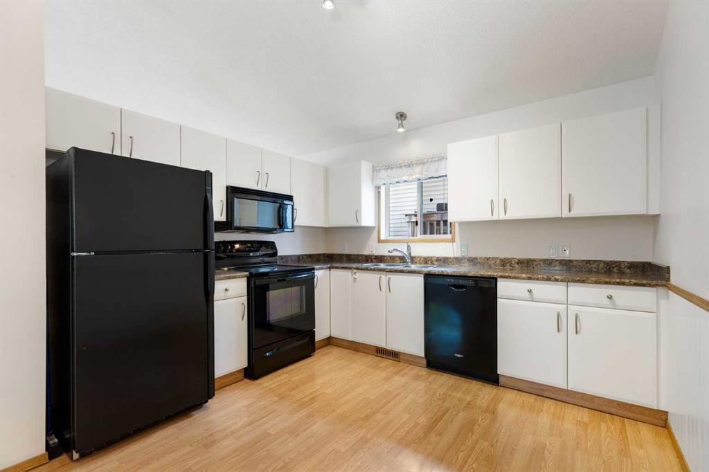 90 Martinridge Crescent Ne, Calgary, AB - Indoor Photo Showing Kitchen With Double Sink