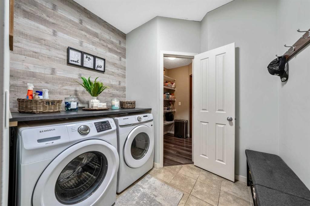 16 Brightoncrest Manor Se, Calgary, AB - Indoor Photo Showing Laundry Room