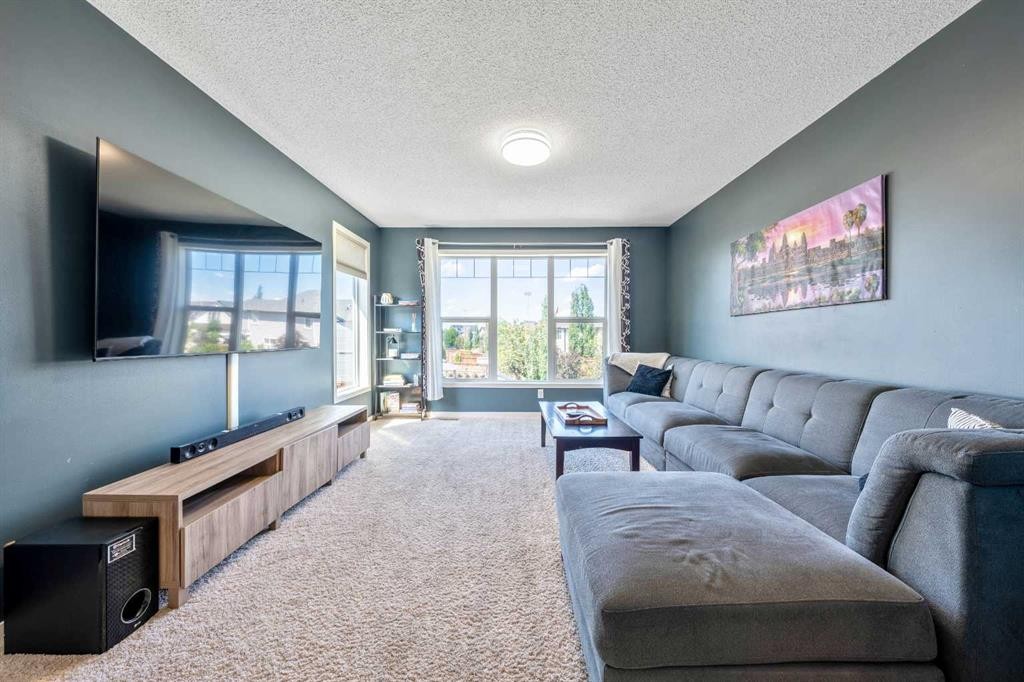 16 Brightoncrest Manor Se, Calgary, AB - Indoor Photo Showing Living Room