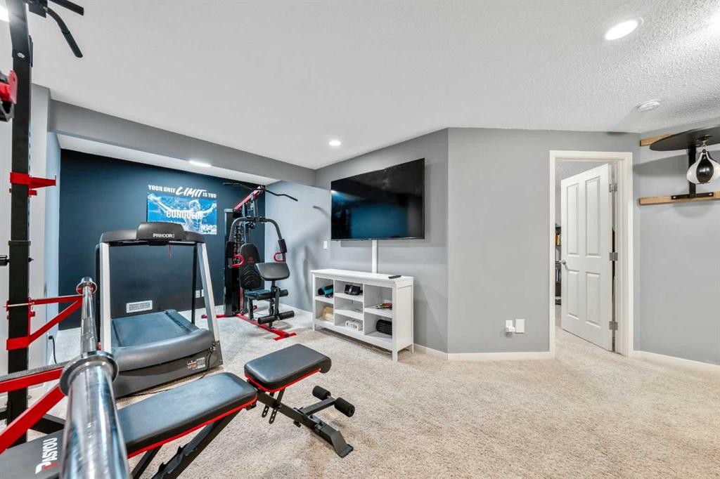16 Brightoncrest Manor Se, Calgary, AB - Indoor Photo Showing Gym Room
