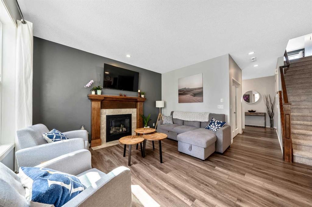 16 Brightoncrest Manor Se, Calgary, AB - Indoor Photo Showing Living Room With Fireplace