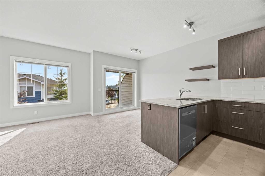 304 Jumping Pound Common, Cochrane, AB - Indoor Photo Showing Kitchen
