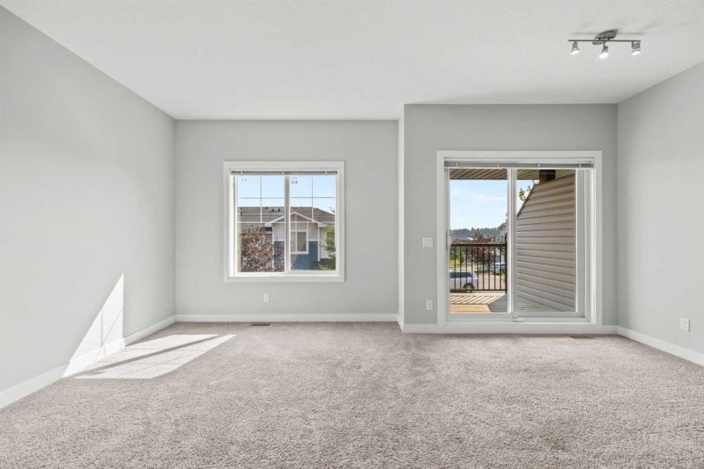 304 Jumping Pound Common, Cochrane, AB - Indoor Photo Showing Other Room