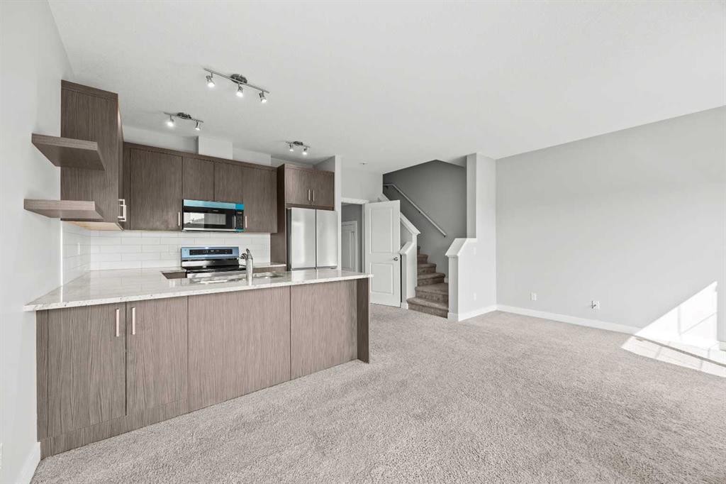 304 Jumping Pound Common, Cochrane, AB - Indoor Photo Showing Kitchen