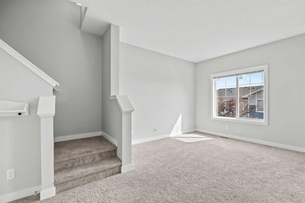 304 Jumping Pound Common, Cochrane, AB - Indoor Photo Showing Other Room