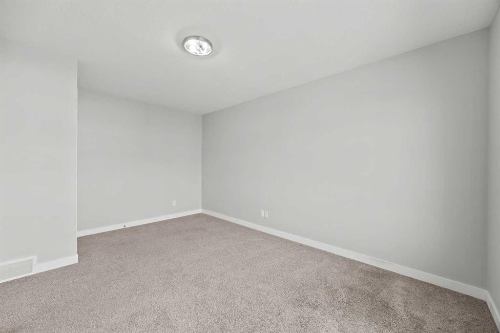 304 Jumping Pound Common, Cochrane, AB - Indoor Photo Showing Other Room
