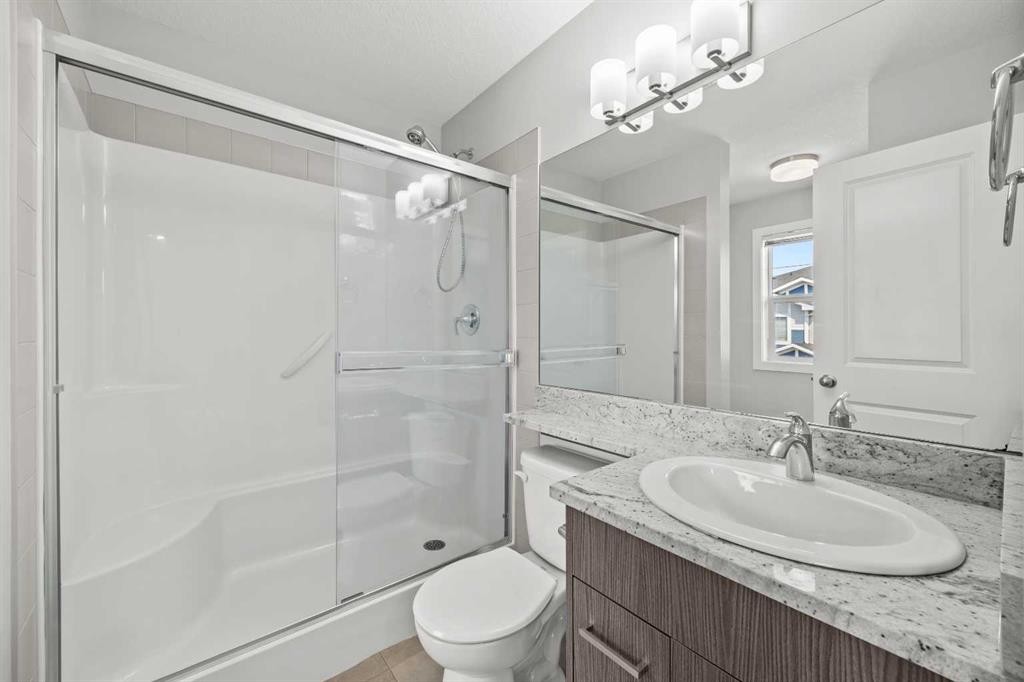 304 Jumping Pound Common, Cochrane, AB - Indoor Photo Showing Bathroom