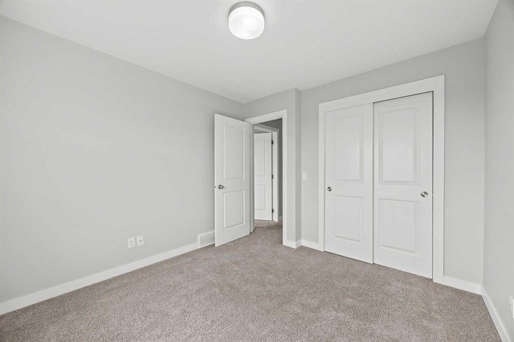 304 Jumping Pound Common, Cochrane, AB - Indoor Photo Showing Other Room