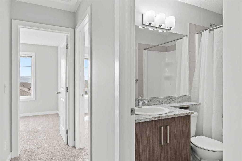 304 Jumping Pound Common, Cochrane, AB - Indoor Photo Showing Bathroom