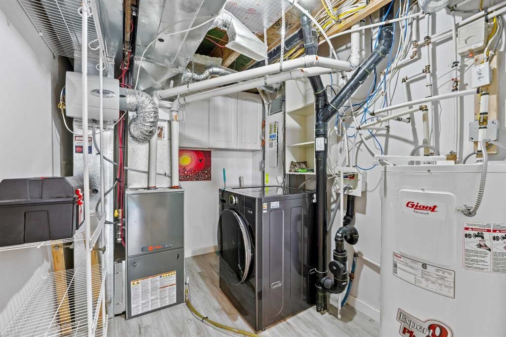 304 Jumping Pound Common, Cochrane, AB - Indoor Photo Showing Laundry Room