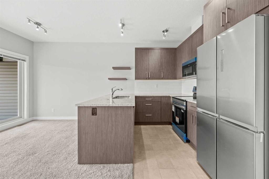304 Jumping Pound Common, Cochrane, AB - Indoor Photo Showing Kitchen