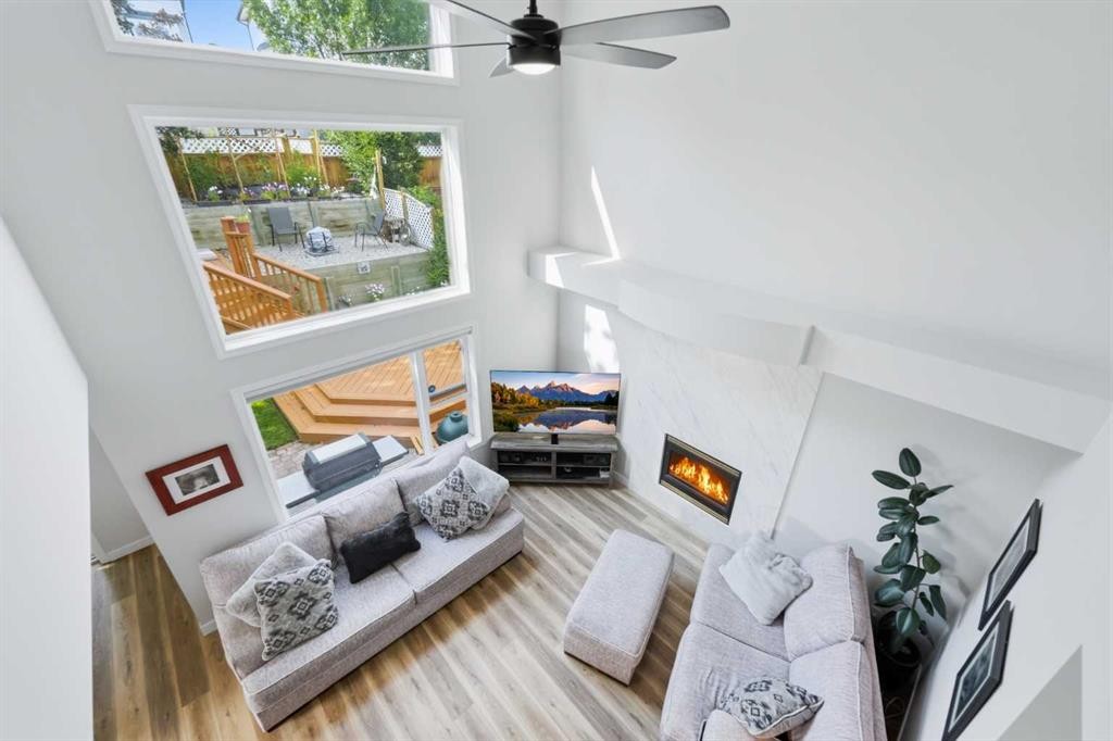 72 Arbour Crest Road Nw, Calgary, AB - Indoor Photo Showing Other Room With Fireplace