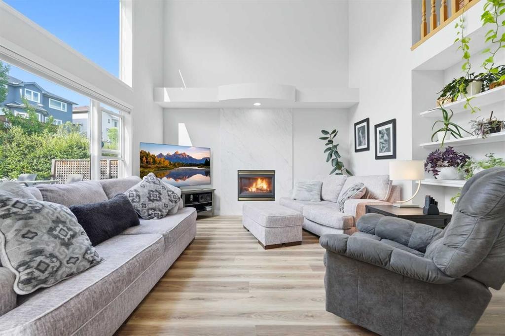 72 Arbour Crest Road Nw, Calgary, AB - Indoor Photo Showing Living Room With Fireplace