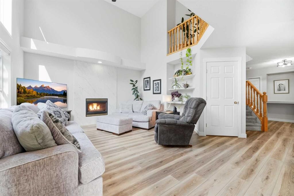 72 Arbour Crest Road Nw, Calgary, AB - Indoor Photo Showing Living Room With Fireplace