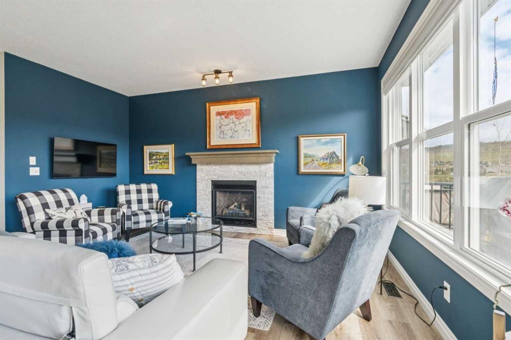 14 Riviera View, Cochrane, AB - Indoor Photo Showing Living Room With Fireplace