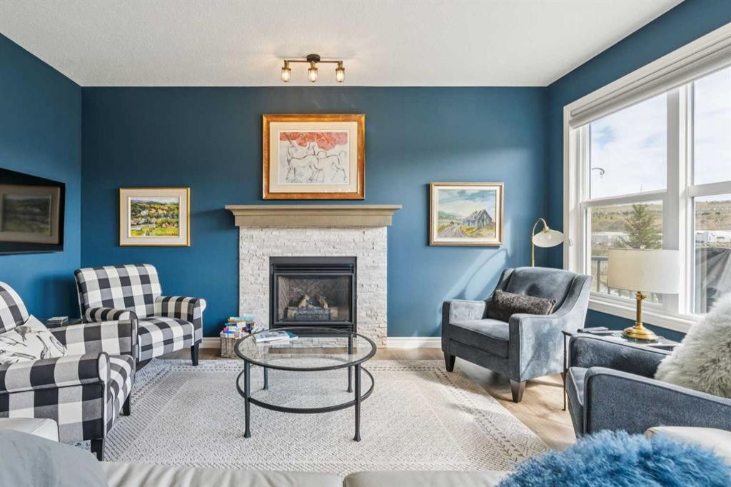 14 Riviera View, Cochrane, AB - Indoor Photo Showing Living Room With Fireplace